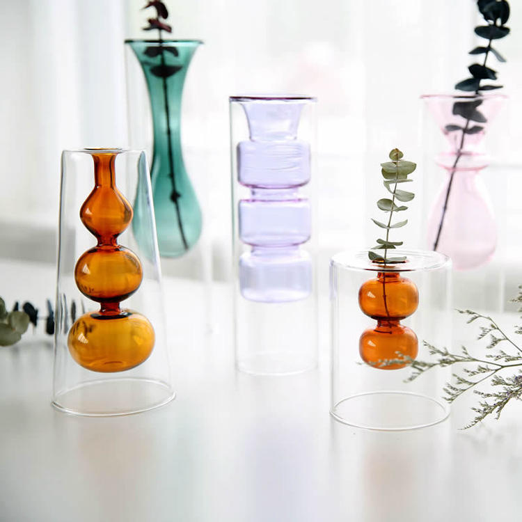 Close-up of amber purple teal and pink glass vases