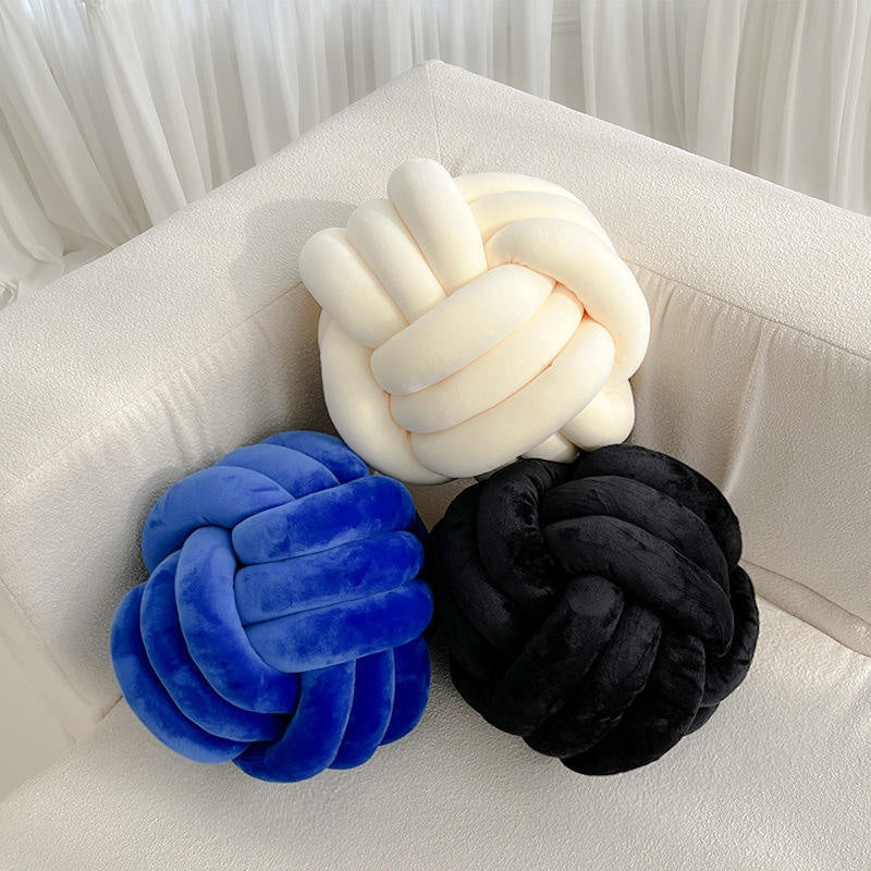 Cream blue and black knot cushions