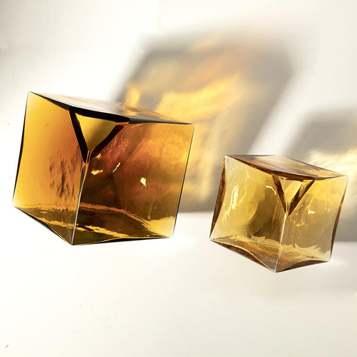 Two amber geometric glass vases in different sizes
