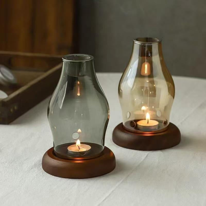 Pair of decorative glass candle holders with wooden bases