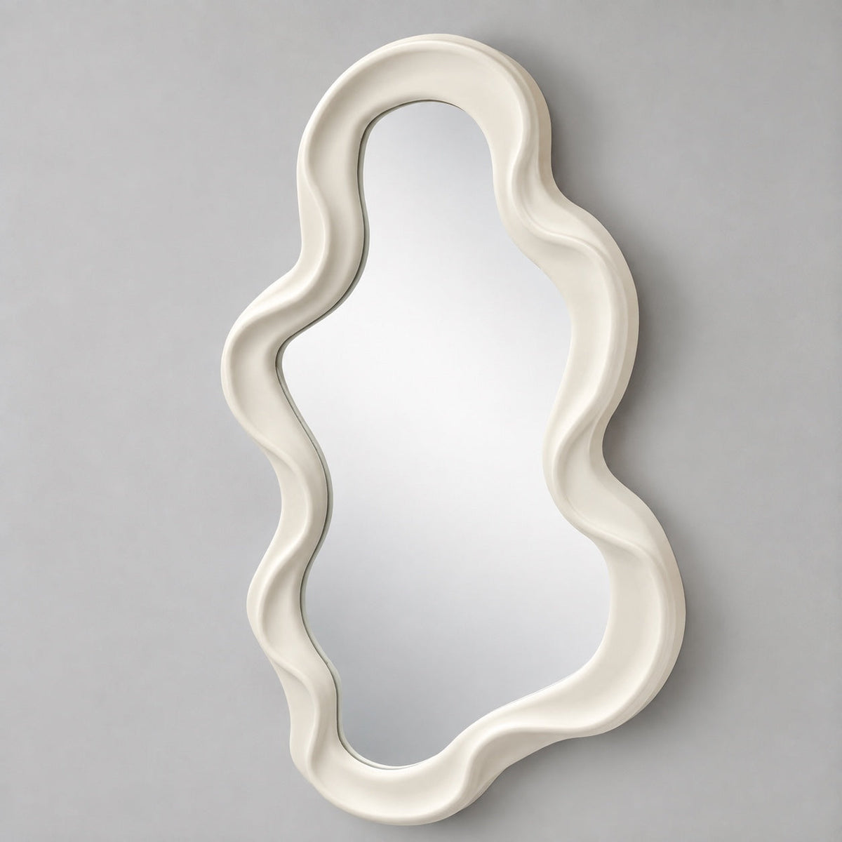 Irregular shaped ivory mirror with wide flowing frame