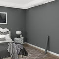 Dark grey self-adhesive wallpaper used on a bedroom wall
